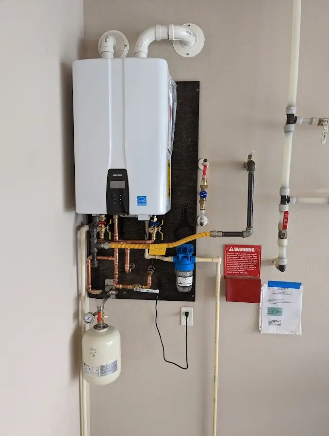 Professional plumber installing copper piping in a Gunbarrel home